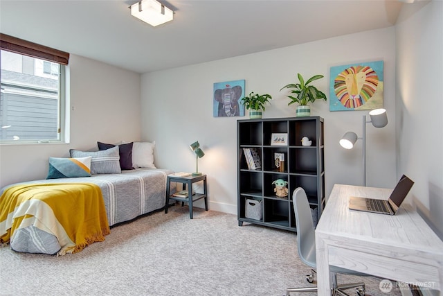 bedroom with carpet flooring and baseboards