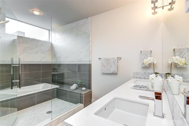 bathroom with double vanity, a sink, and a walk in shower
