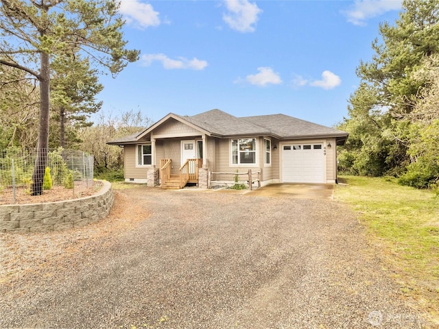 single story home with an attached garage, driveway, and roof with shingles
