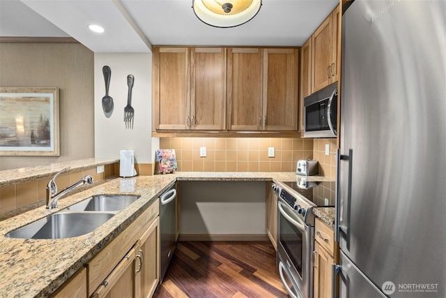 3600 Suncadia Trl Unit 4018, Cle Elum, WA 98922 - kitchen featuring light stone countertops, stainless steel appliances, backsplash, dark wood-style flooring, and a sink