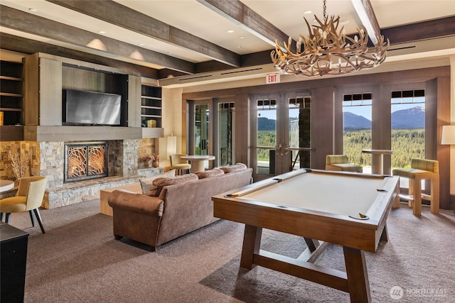 3600 Suncadia Trl Unit 4018, Cle Elum, WA 98922 - recreation room featuring beam ceiling, a fireplace, a mountain view, and carpet