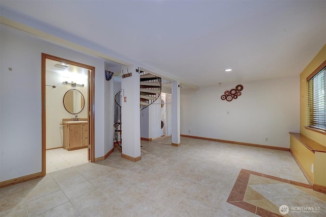 interior space with baseboards, stairs, and light tile patterned floors