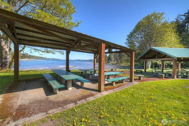 view of property's community featuring a lawn, a gazebo, and a water view