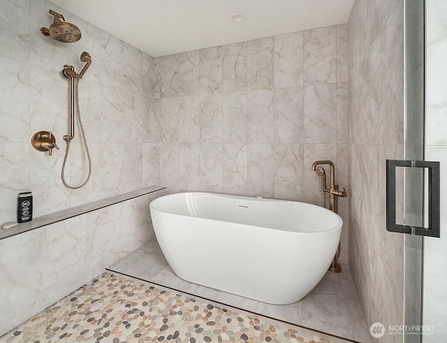 5023 Harbor Hills Dr, Freeland, WA 98249 - bathroom featuring a tile shower, a freestanding tub, and tile walls