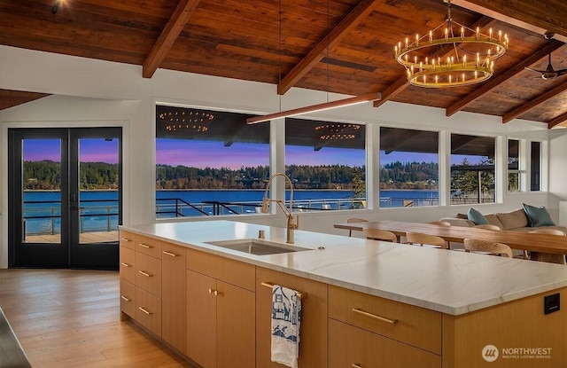 5023 Harbor Hills Dr, Freeland, WA 98249 - kitchen with wooden ceiling, lofted ceiling with beams, a sink, and a water view