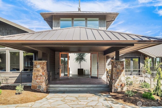 5023 Harbor Hills Dr, Freeland, WA 98249 - entrance to property with covered porch, a standing seam roof, and metal roof