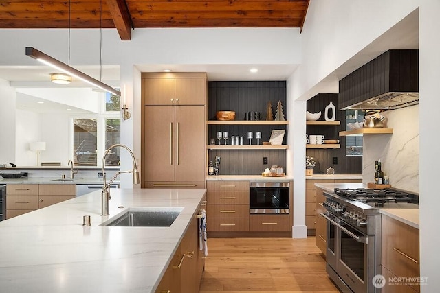 5023 Harbor Hills Dr, Freeland, WA 98249 - kitchen featuring light stone counters, stainless steel appliances, light wood finished floors, and a sink
