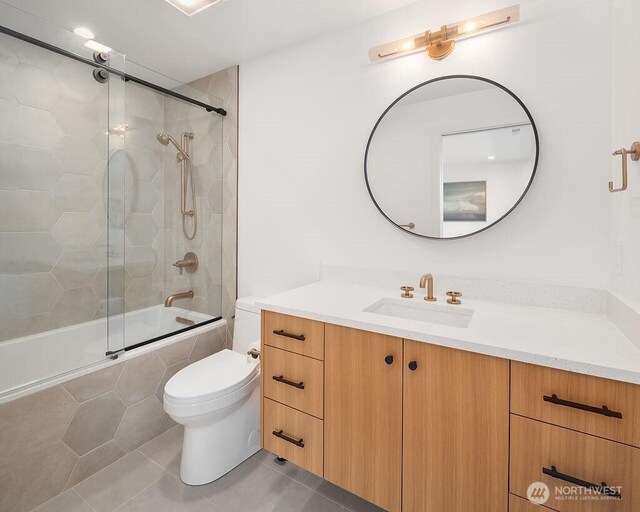 5023 Harbor Hills Dr, Freeland, WA 98249 - full bath featuring vanity, toilet, tile patterned flooring, and tiled shower / bath