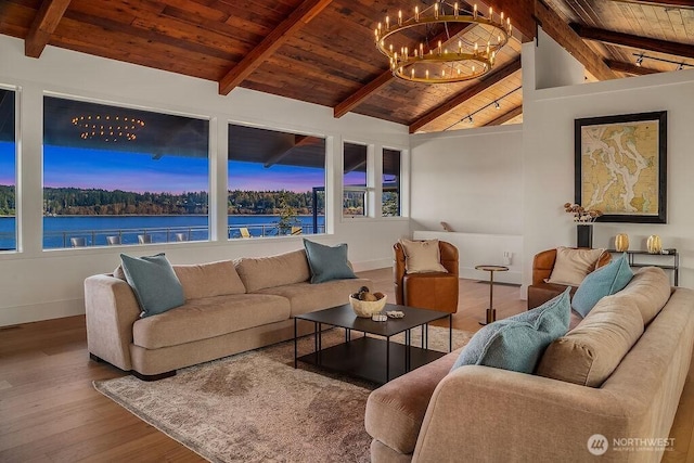 5023 Harbor Hills Dr, Freeland, WA 98249 - living area with wood finished floors, vaulted ceiling with beams, wooden ceiling, baseboards, and a chandelier