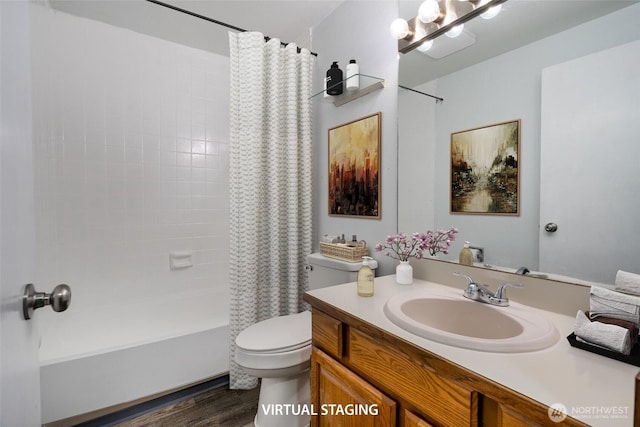 bathroom featuring vanity, toilet, wood finished floors, and shower / tub combo