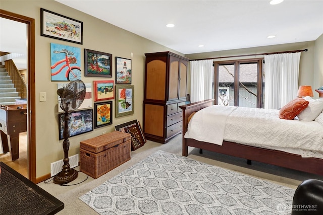 bedroom with baseboards, visible vents, recessed lighting, and light colored carpet