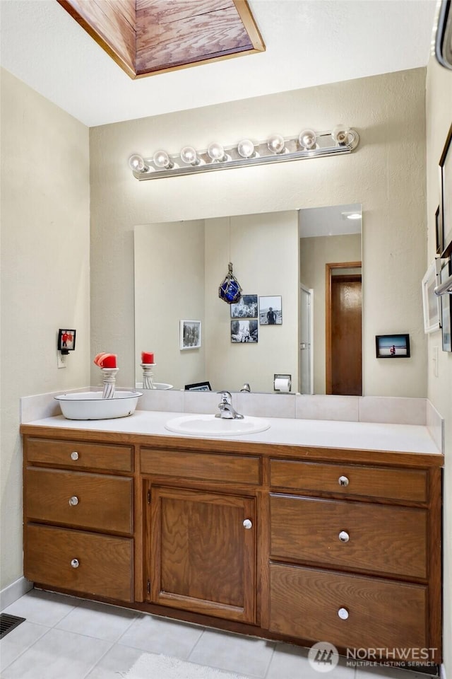 bathroom featuring vanity, tile patterned floors, and visible vents