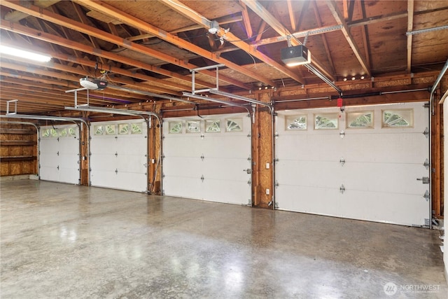 garage featuring a garage door opener
