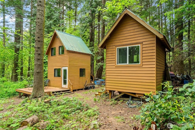 89 Eliza Is, Bellingham, WA 98226 - rear view of house featuring a deck and a forest view