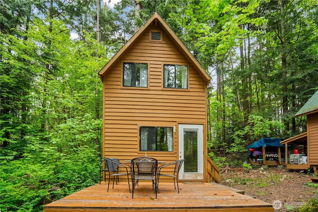 89 Eliza Is, Bellingham, WA 98226 - back of property featuring outdoor dining area and a deck