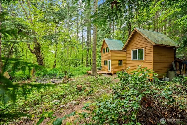 89 Eliza Is, Bellingham, WA 98226 - view of side of property with a deck and metal roof