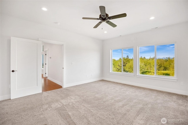 unfurnished room featuring carpet flooring, recessed lighting, baseboards, and a ceiling fan