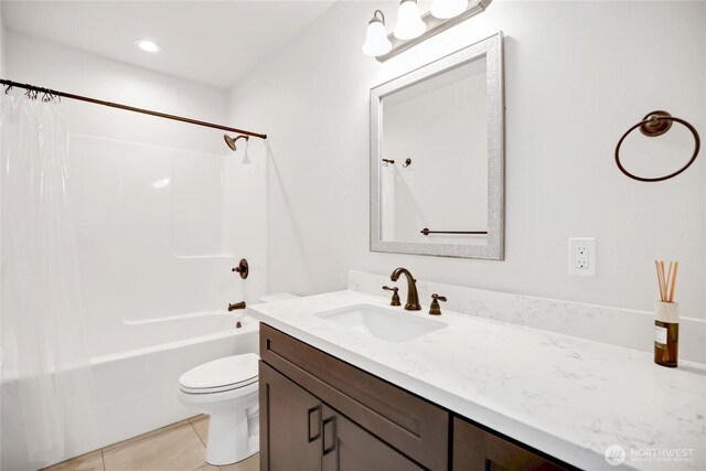full bath with vanity, tile patterned floors, toilet, and shower / tub combo with curtain