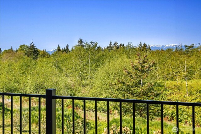 exterior space with a wooded view