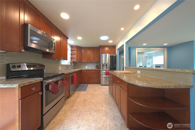 kitchen with appliances with stainless steel finishes, tasteful backsplash, open shelves, a sink, and recessed lighting