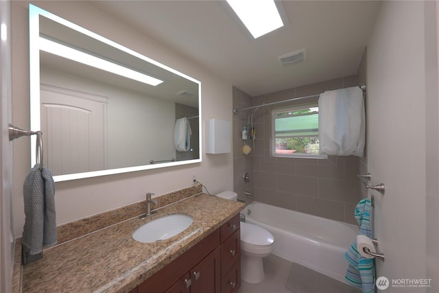 full bathroom featuring vanity, toilet, visible vents, and bathtub / shower combination