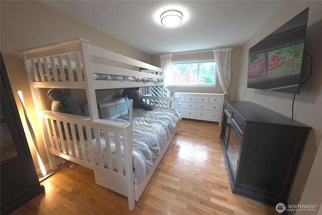 bedroom featuring light wood-style flooring
