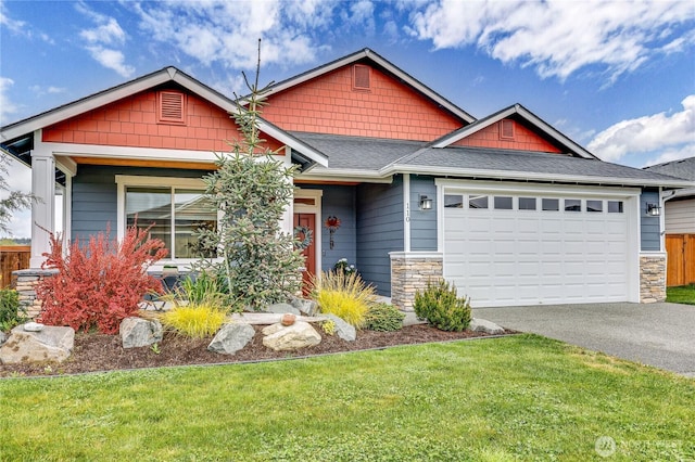 110 Blue Glacier Loop, Sequim, WA 98382 - craftsman house featuring a garage, driveway, a front lawn, and stone siding