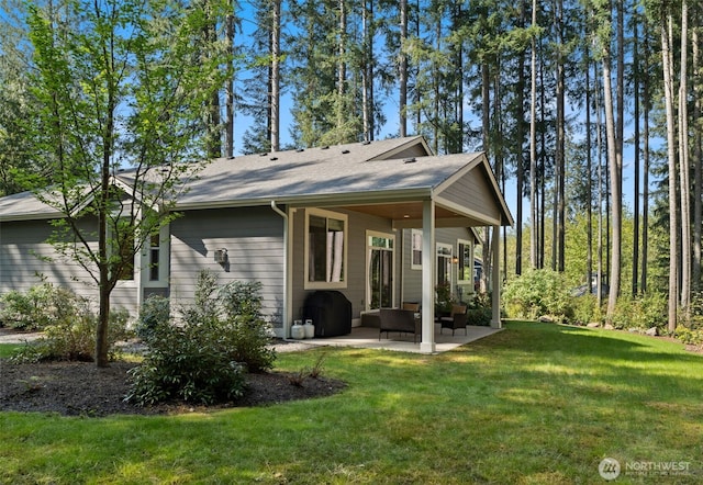 13978 Hidden Heights Ln NE, Bainbridge Island, WA 98110 - rear view of property featuring a patio area, a yard, an outdoor hangout area, and roof with shingles