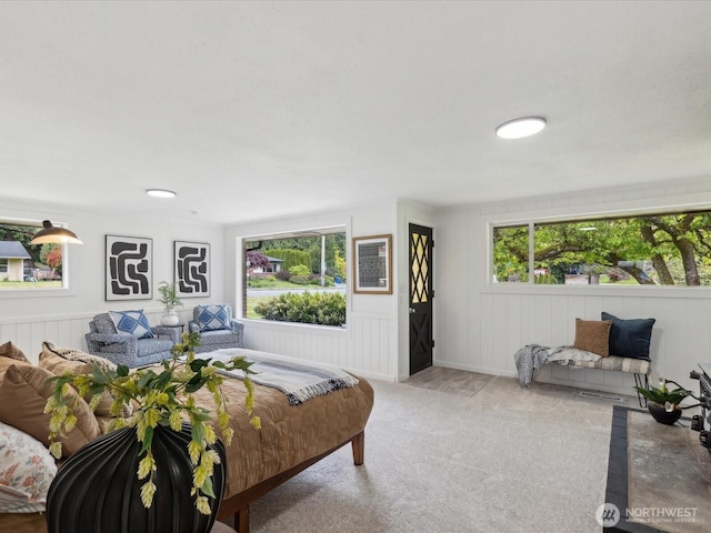 living area with healthy amount of natural light and carpet flooring