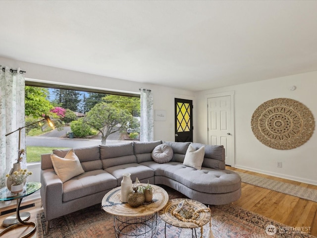 living room with wood finished floors and baseboards