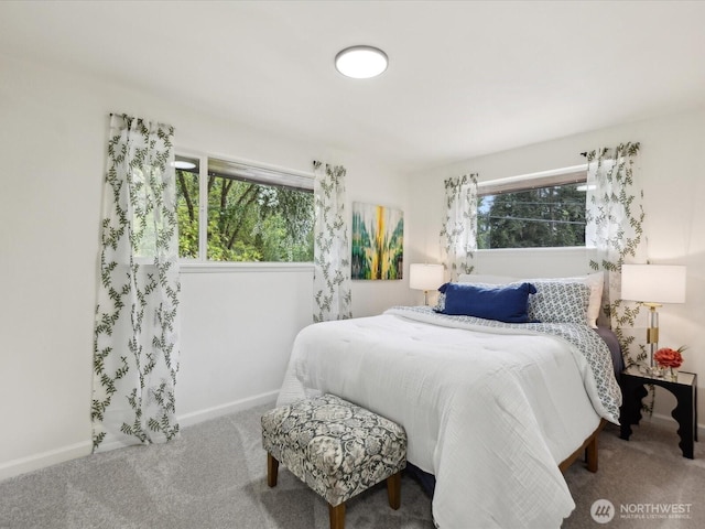 carpeted bedroom with baseboards