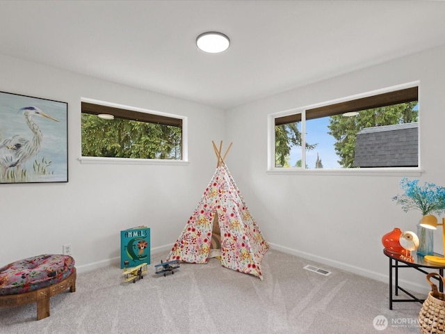 game room with carpet floors and baseboards