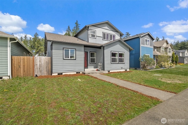 bungalow-style house featuring a front lawn and fence