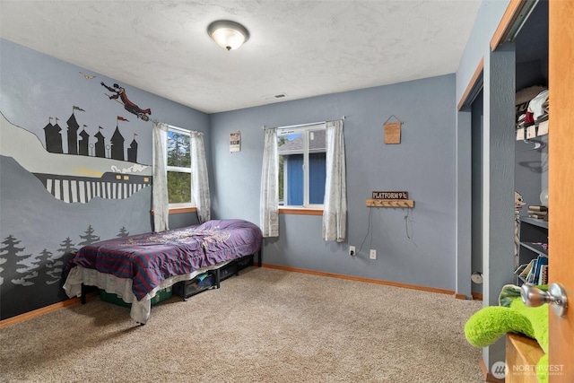 bedroom with baseboards, carpet flooring, and visible vents