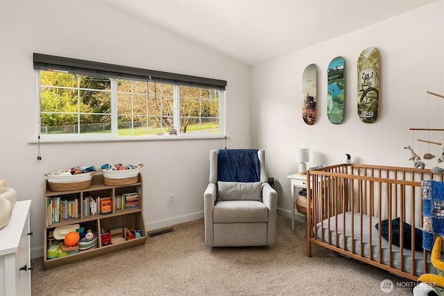 bedroom with vaulted ceiling, visible vents, a nursery area, carpet floors, and baseboards