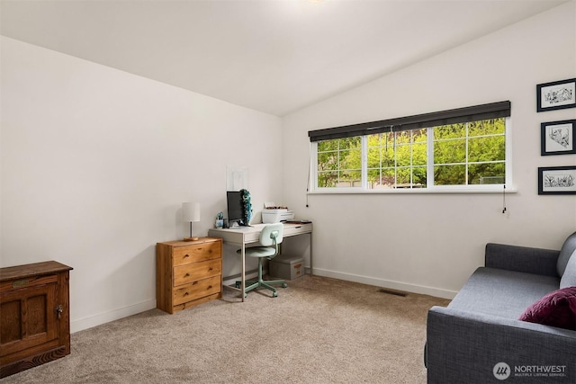 home office with vaulted ceiling, visible vents, carpet flooring, and baseboards