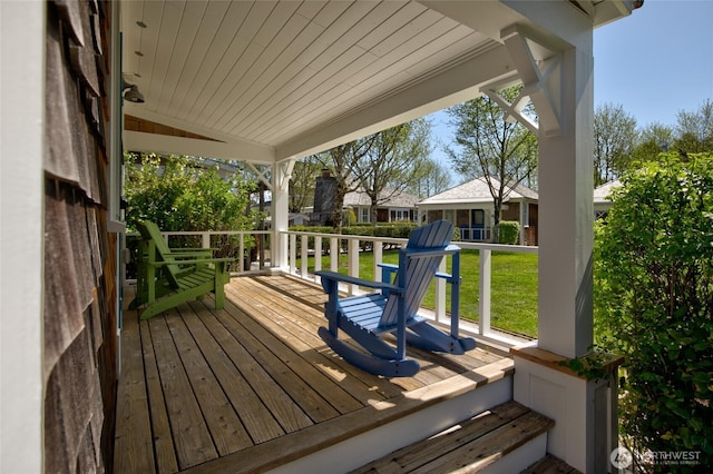 wooden deck with a yard