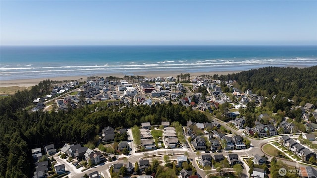 aerial overview of property's location featuring nearby suburban area and expansive beach