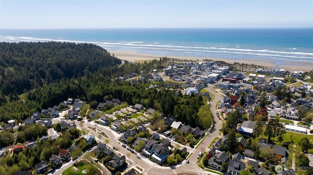 aerial view of property and surrounding area with nearby suburban area and a nearby body of water