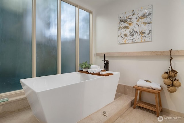 full bathroom with a soaking tub