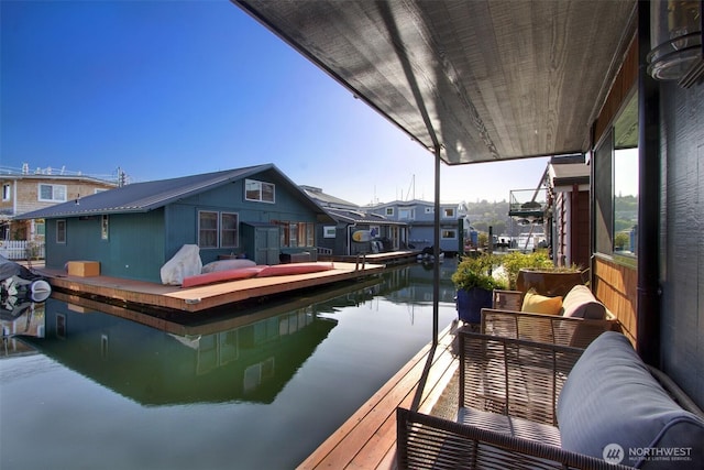 dock area featuring a residential view and a water view