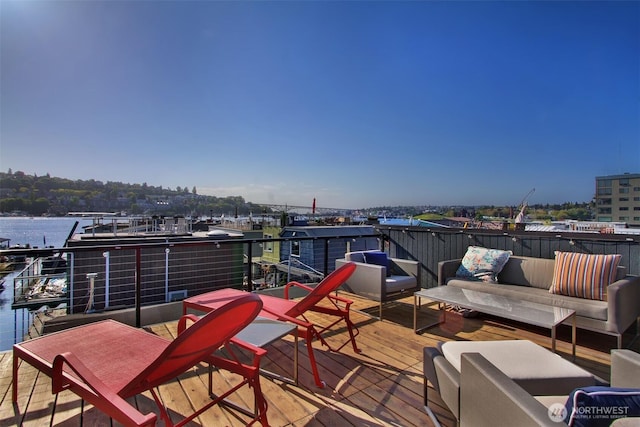 wooden terrace featuring a water view
