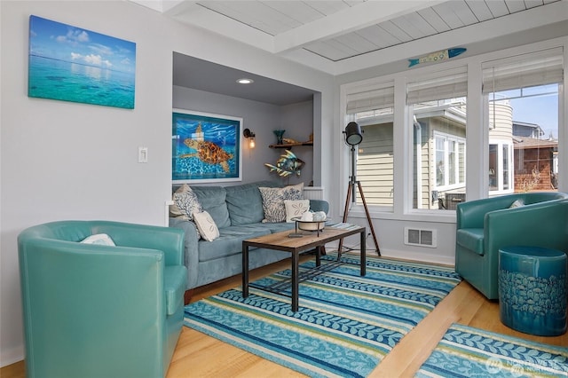 1213 E Shelby St Unit 7, Seattle, WA 98102 - living area featuring beamed ceiling, visible vents, and wood finished floors