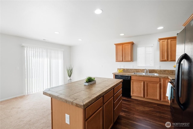 kitchen with recessed lighting, tile countertops, a center island, a sink, and black appliances