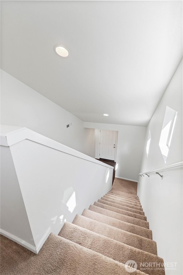 stairway featuring baseboards, carpet, recessed lighting, and visible vents