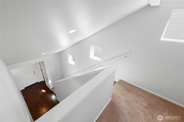 staircase featuring recessed lighting and baseboards