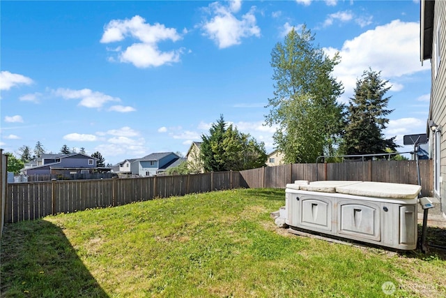 view of yard featuring a fenced backyard and a residential view
