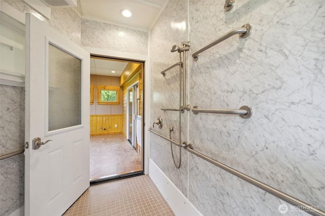 bathroom with walk in shower, tile patterned flooring, and wainscoting