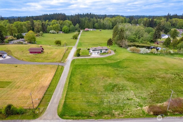 bird's eye view with a forest view and a rural view
