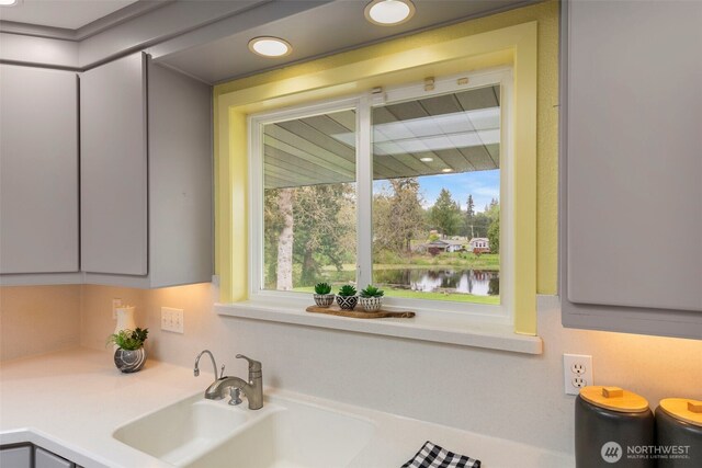 room details with recessed lighting, a sink, and light countertops